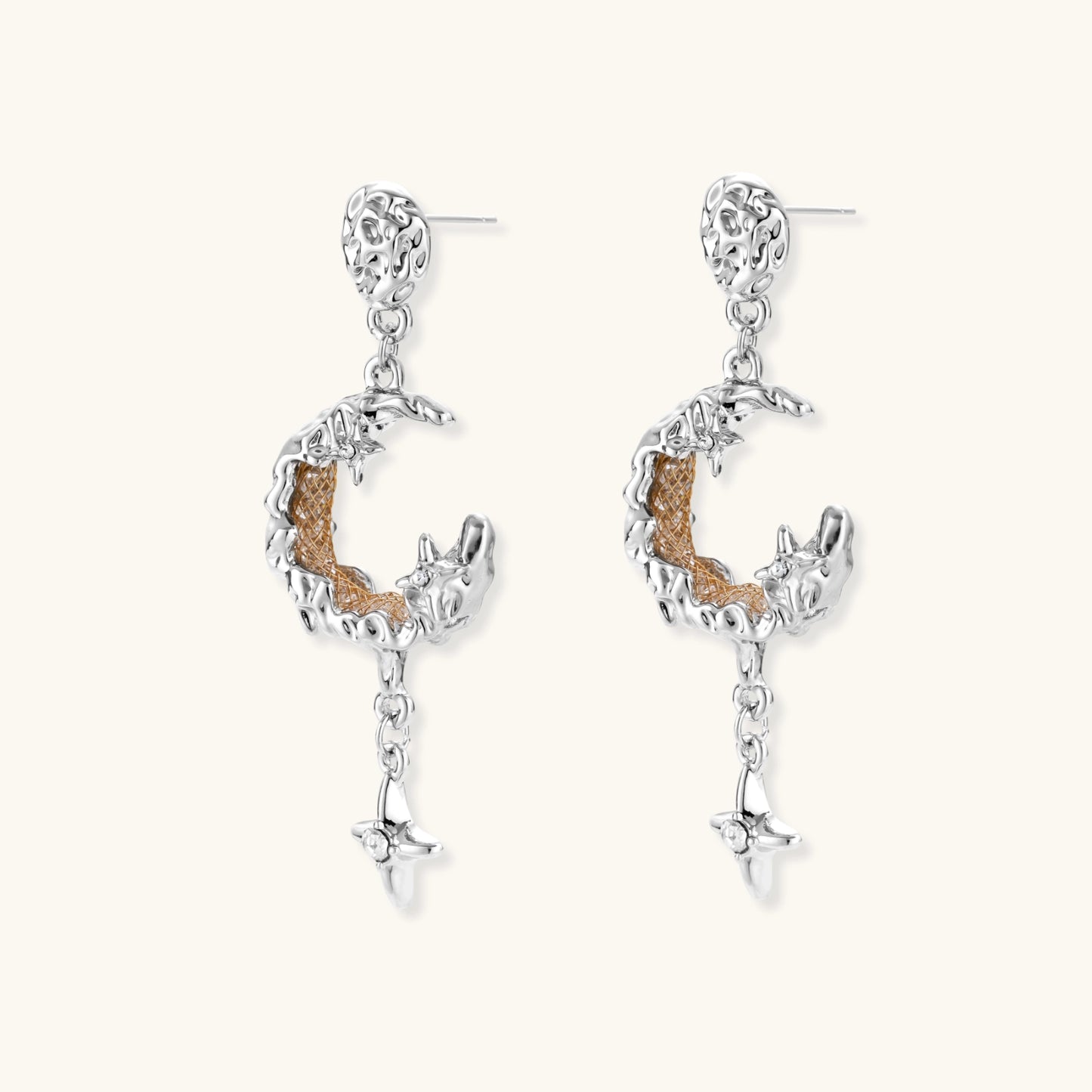 Detailed eco-brass dangle earrings featuring crescent moons with gold rope details and dangling star charms on white background.